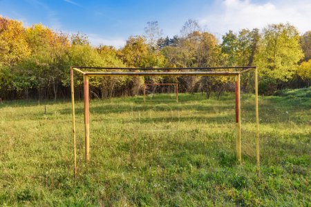 Photo for Abandoned soccer field. Overgrown grass on football pitch. - Royalty Free Image