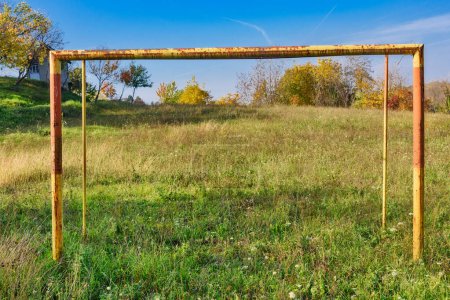 Photo for Abandoned soccer field. Overgrown grass on football pitch. - Royalty Free Image