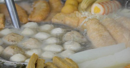 Photo for The Japanese food oden is being cooked in a pot on a small street vendor. - Royalty Free Image