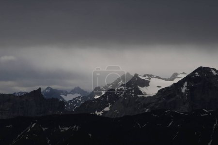 Photo for Moody dark sky over mountains in the Bernese Oberland. - Royalty Free Image