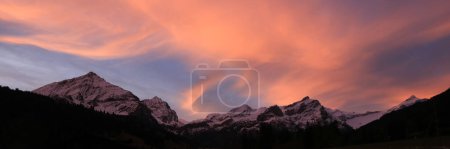 Photo for Colorful morning sky over a mountain range in Gsteig Bei Gstaad. - Royalty Free Image