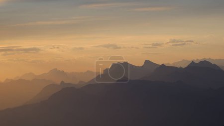 Photo for Outlines of mountain ranges in the Bernese Oberland seen from Niesen Kulm. - Royalty Free Image