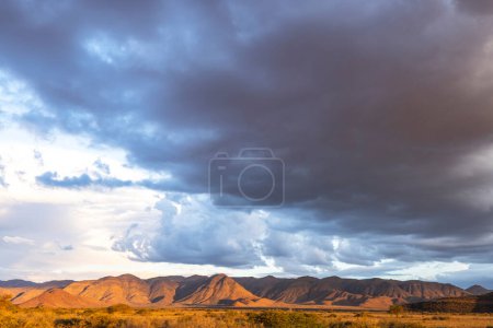 Dark clouds gather above the mountain Namibia