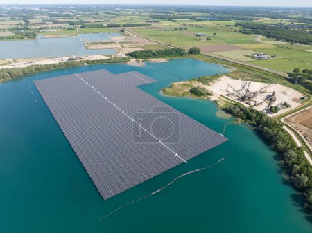 Solar panel farm on water surface. Aerial drone view in The Netherlands.