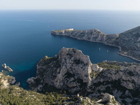 Photo for Massif des Calanques is a wild and rugged terrain that stretches from the ninth arrondissement of Marseille eastwards towards Cassis. Aerial drone photo. - Royalty Free Image