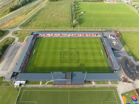 Photo for Almere, 16th of July, The Netherlands. Aerial drone view of the Yanmar Stadium, the home base of Almere City FC, Eredivisie football club. - Royalty Free Image