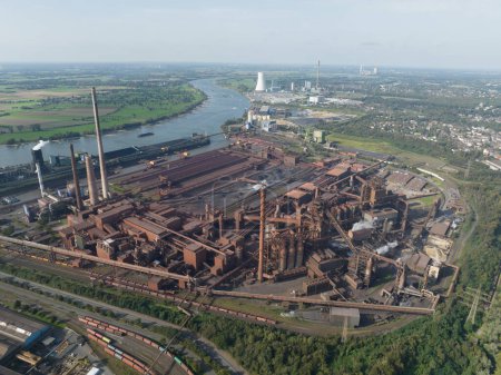Heavy metal industry, blast furnaces, one of the largest steelworks in Germany, high chimneys, which are part of the sintering plant. Duisburg, Germany aerial drone view.