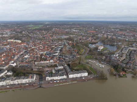 Photo for Aerial overview of the city of Zutphen, along the river Ijssel in Gelderland, The Netherlands. Birds eye aerial drone view in the Dutch province of Gelderland. Holland - Royalty Free Image