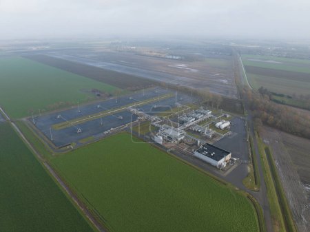 Natural gas fields near Groningen causing earthquakes, Mining of natural resources industrial installation. Birds eye aerial drone view.