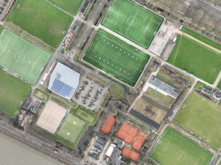 Sports fields recreation and leisure healthy activity birds eye aerial drone view.
