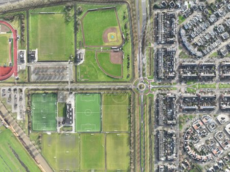 Aerial drone top down view on sports field, amateur sports grounds. Birds eye top down overview. Recreation leisure and health lifestyle. The Netherlands.