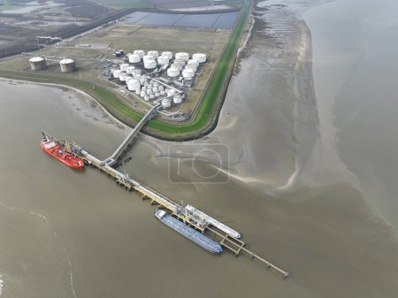 Tank terminal of Terneuzen, Bulk energy and chemical products are stored in these terminals. multimodal transport of sea and land. Fuels and energy products. Storage cotnainers and a ship docked for