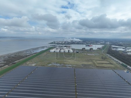 Aerial drone view on the tank terminal of Terneuzen and the chemical park in the background. Production of plastics. Storage and distribution of energy and petroleum products. Terneuzen, the