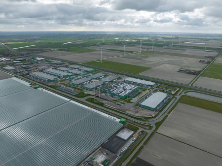 Aerial drone overview on internet infrastructure, data centers in Middenmeer, The Netherlands. Large big tech companies.
