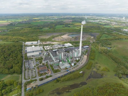 The Asdonkshof waste incineration plant in Kamp Lintfort. Thermal waste treatment and recycling. Combustion of waste, converted into new energy. Industrial installation. Aerial drone view.