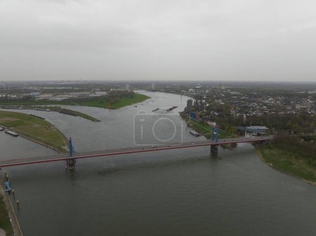 The Friedrich-Ebert-Brucke is a cable-stayed bridge for road traffic over the Rhine near the German city of Duisburg. Aerial drone view.