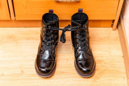 Photo for April fools day concept.A shoe tied together at home in the living room. - Royalty Free Image