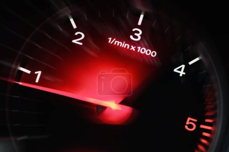 Photo for Motion blur of a car instrument panel dashboard odometer with red illuminated display.Car speedometer. High speed car speedometer and motion blur at night. - Royalty Free Image