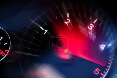 Photo for Motion blur of a car instrument panel dashboard odometer with red illuminated display.Car speedometer. High speed car speedometer and motion blur at night. - Royalty Free Image