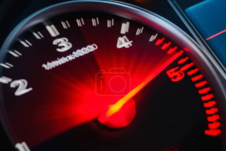 Photo for Motion blur of a car instrument panel dashboard odometer with red illuminated display.Car speedometer. High speed car speedometer and motion blur at night.Blurred image. - Royalty Free Image