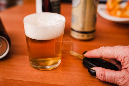 Foto de Alcohol addiction, you can't drive, violation of the law.Toned. - Imagen libre de derechos