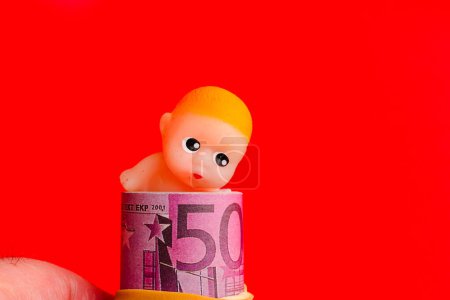 Foto de Kid paper euro money,child trafficking concept.Copy space. - Imagen libre de derechos