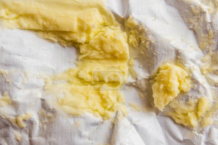 Butter residue, leftover on the paper, macro shot.