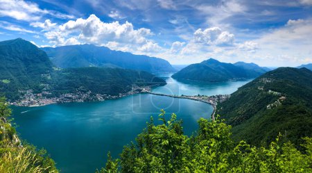 Photo for Wide panoramic view over the city of Lugano, the Lugano Lake and Swiss Alps, visible from Monte San Salvatore observation terrace, canton of Ticino, Switzerland. - Royalty Free Image