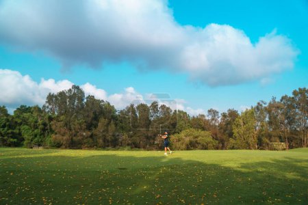 Photo for Queensland, Gold CoastAustralia - December, 2019: Golfer swinging the club at the Glades Golf Course, one of Australias most prestigious resort golf courses, designed by Greg Norman. - Royalty Free Image