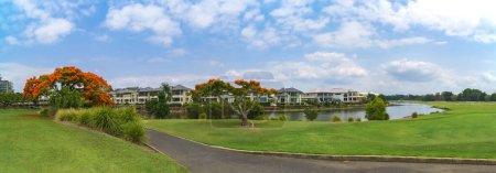 Photo for Panoramic view of the Glades Golf Course, one of Australia's most prestigious resort golf courses in Queensland, with stunning gardens, boardwalks and waterway. - Royalty Free Image