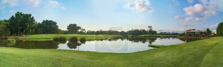 Photo for Wide panoramic view of the Glades Golf Course, one of Australia's most prestigious resort golf courses in Queensland, with stunning gardens, boardwalks and waterway. - Royalty Free Image