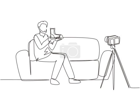 Illustration for Single continuous line drawing social media influencer reviewing boots. Smiling young Arab man vlogging about men's sports shoe and filming himself at home on video camera. One line draw design vector - Royalty Free Image