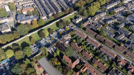 Photo for Aerial photo of the town of York located in North East England and founded by the ancient Romans, showing the York Minster Historical Brick Wall and housing estates that are around the wall. - Royalty Free Image