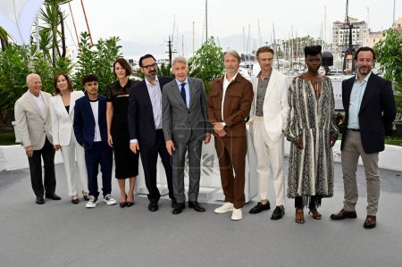 Photo for CANNES, FRANCE. May 19, 2023: Frank Marshall, Kathleen Kennedy, Ethann Isidore, Phoebe Waller-Bridge, James Mangold, Harrison Ford, Mads Mikkelsen, Boyd Holbrook, Shaunette Renee Wilson and Simon Emanuel at the photocall for Indiana Jones and the Dia - Royalty Free Image