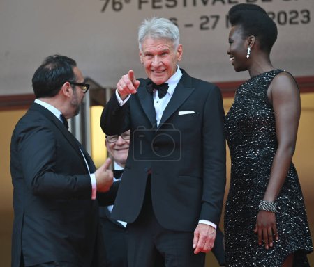 Photo for CANNES, FRANCE. May 18, 2023: James Mangold, Harrison Ford and Shaunette Renee Wilson at the premiere of Indiana Jones and the Dial of Destiny at the 76th Festival de Cannes - Royalty Free Image