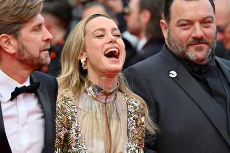 Photo for CANNES, FRANCE. May 16, 2023: Ruben Ostlund, Brie Larson and Denis Menochet at the premiere for Jeanne du Barry at the 76th Festival de Cannes - Royalty Free Image