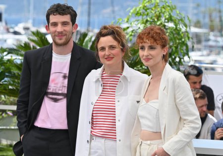 Photo for CANNES, FRANCE. May 27, 2023: Josh O'Connor, Alice Rohrwacher and Carol Duarte at the photocall for La Chimera at the 76th Festival de Cannes - Royalty Free Image