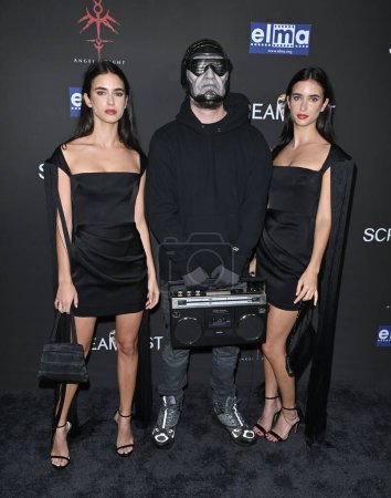 Photo for LOS ANGELES, CA. October 10, 2023:  Renee Herbert, Eddie Alcazar and Elisha Herbert at the premiere for Divinity at Screamfest LA at the TCL Chinese Theatre, Hollywood - Royalty Free Image