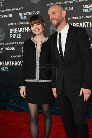 Photo for LOS ANGELES, CA. April 15, 2023:  Lily Collins and Charlie McDowell at the 2023 Breakthrough Prize Ceremony for Science and Mathematics at the Academy Museum - Royalty Free Image