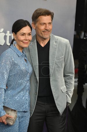 Photo for LOS ANGELES, CA. April 13, 2023:  Nikolaj Coster-Waldau and Nukaaka Coster-Waldau at the premiere for The Last Thing He Told Me at the Regency Village Theatre - Royalty Free Image