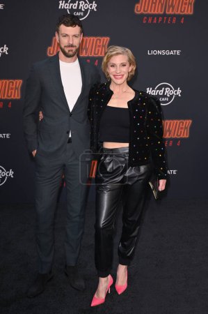 Photo for LOS ANGELES, CA. March 20, 2023:  Katee Sackhoff and Robin Gadsby at the premiere for John Wick: Chapter 4 at the TCL Chinese Theatre, Hollywood - Royalty Free Image