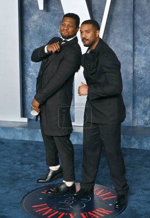 Photo for BEVERLY HILLS, CA. March 12, 2023:  Jonathan Majors and Michael B. Jordan at the 2023 Vanity Fair Oscar Party at the Wallis Annenberg Center - Royalty Free Image