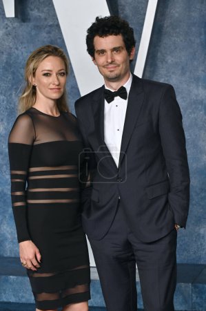 Photo for BEVERLY HILLS, CA. March 12, 2023:  Damien Chazelle and Olivia Hamilton at the 2023 Vanity Fair Oscar Party at the Wallis Annenberg Center - Royalty Free Image