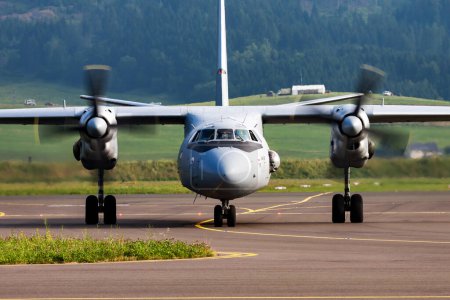 Photo for Zeltweg, Austria - June 28, 2013: Military transport plane at air base. Air force flight operation. Aviation and aircraft. Air defense. Military industry. Fly and flying. - Royalty Free Image