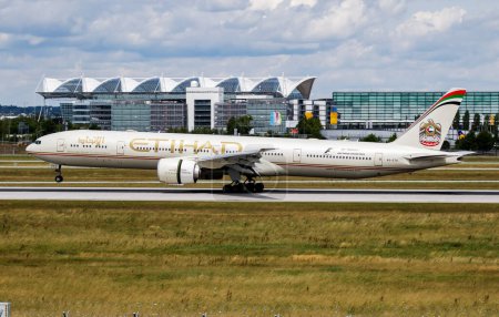 Photo for Munich / Germany - July 11, 2017: Etihad Airways Boeing 777-300ER A6-ETK passenger plane arrival and landing at Munich Airport - Royalty Free Image