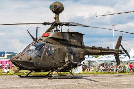 Photo for Sliac / Slovakia - August 3, 2019: Croatian Air Force Bell OH-58D Kiowa Warrior 324 attack helicopter static display at SIAF Slovak International Air Fest 2019 - Royalty Free Image