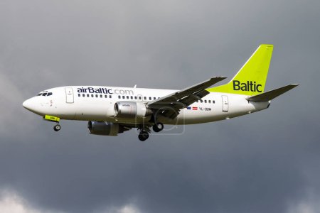 Photo for Amsterdam, Netherlands - August 15, 2014: Air Baltic passenger plane at airport. Schedule flight travel. Aviation and aircraft. Air transport. Global international transportation. Fly and flying. - Royalty Free Image