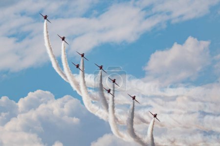 Photo for Aerobatic team at airshow. Flight demonstration and formation flying. Air force and military show. Airport and air base. Aviation and aircraft. Fly and flying. Commercial theme. - Royalty Free Image