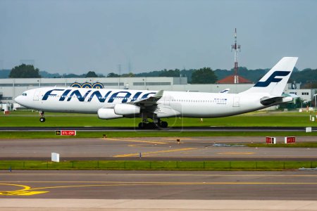 Photo for Brussels, Belgium - September 11, 2014: Finnair passenger plane at airport. Schedule flight travel. Aviation and aircraft. Air transport. Global international transportation. Fly and flying. - Royalty Free Image
