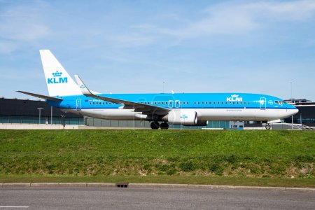 Photo for Amsterdam, Netherlands - April 12, 2015: KLM passenger plane at airport. Schedule flight travel. Aviation and aircraft. Air transport. Global international transportation. Fly and flying. - Royalty Free Image
